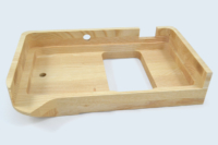 Capot usiné en bois massif pour appareil paramédical.
