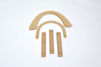 Pièces pour gainage cuir en hêtre massif et MDF, bagagerie luxe.